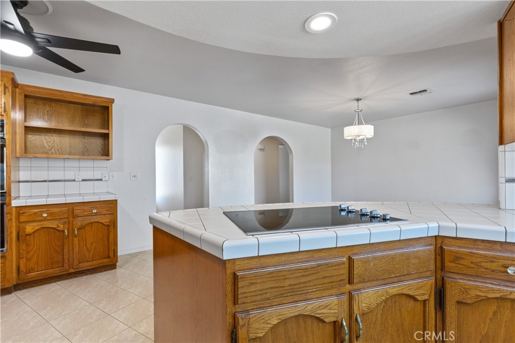 1670 Southfork Place Paso Robles, CA 93446 - Photo 31 of 61 a bathroom with a granite countertop sink a mirror and shower