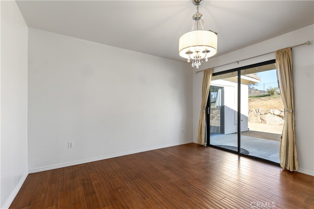 1670 Southfork Place Paso Robles, CA 93446 - Photo 36 of 61 a view of an empty room with wooden floor and a window