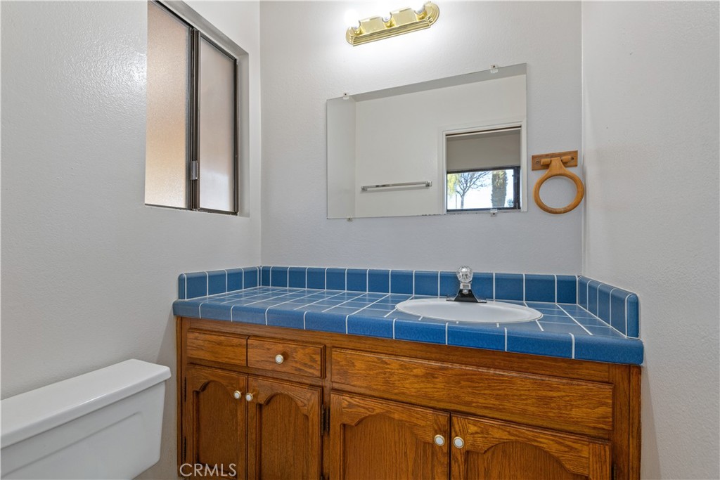 1670 Southfork Place Paso Robles, CA 93446 - Photo 39 of 61 a bathroom with a sink and a mirror