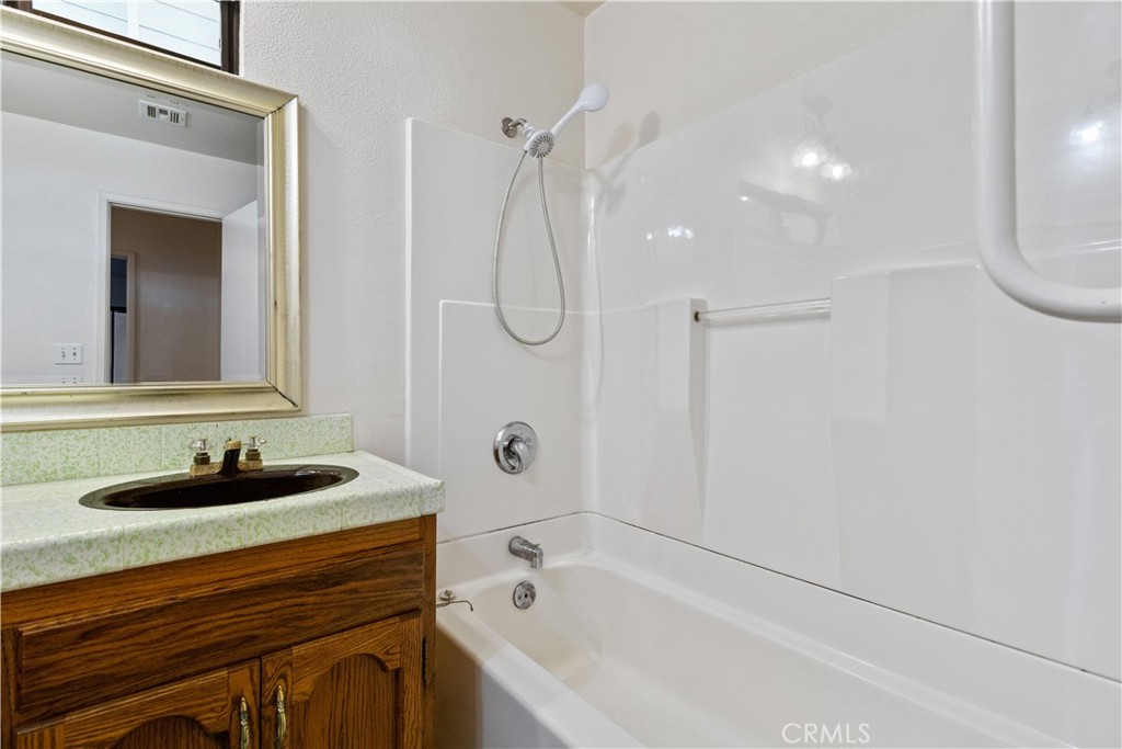 1670 Southfork Place Paso Robles, CA 93446 - Photo 43 of 61 a bathroom with a sink vanity granite tub and shower