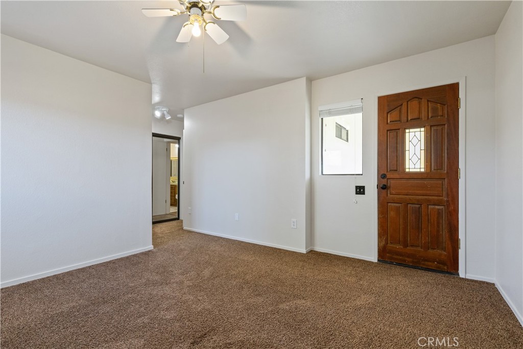 1670 Southfork Place Paso Robles, CA 93446 - Photo 44 of 61 an empty room with chandelier fan and windows