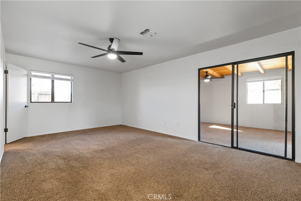 1670 Southfork Place Paso Robles, CA 93446 - Photo 45 of 61 an empty room with fan and windows