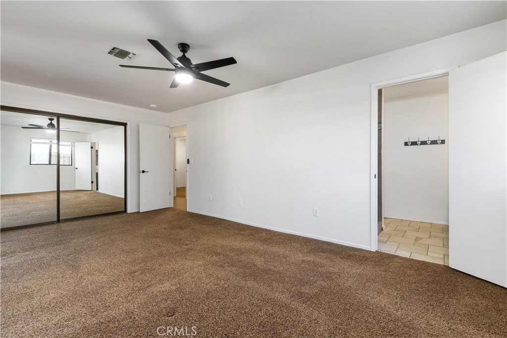 1670 Southfork Place Paso Robles, CA 93446 - Photo 48 of 61 an empty room with fan and windows