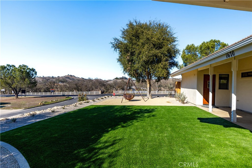 1670 Southfork Place Paso Robles, CA 93446 - Photo 6 of 61 a view of a patio with table and chairs under an umbrella