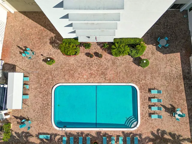 an aerial view of a house with a lake view