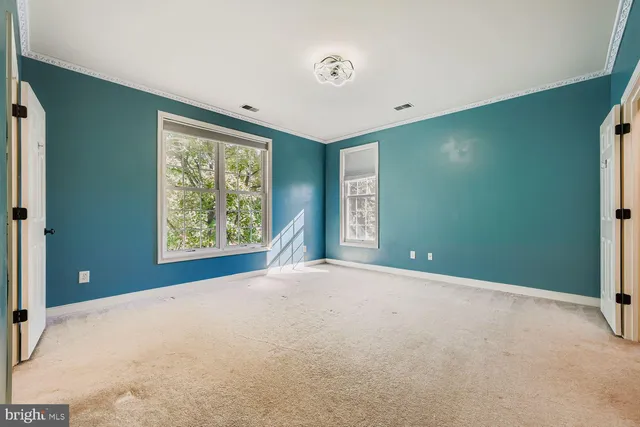 a bathroom with a double vanity sink mirror and shower