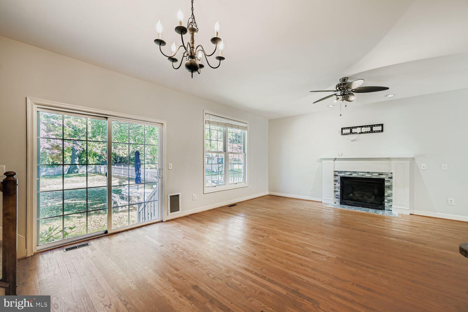 1250 Breitwert Avenue Odenton, MD 21113 - Photo 7 of 32 a view of an empty room with a fireplace and a window