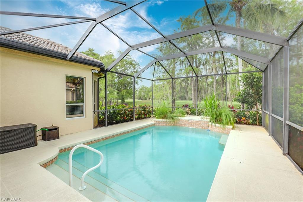 2885 Lone Pine Lane Naples, FL 34119 - Photo 19 of 29 a view of an indoor swimming pool
