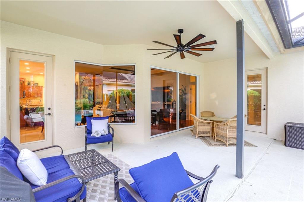 2885 Lone Pine Lane Naples, FL 34119 - Photo 20 of 29 a living room with furniture and a window