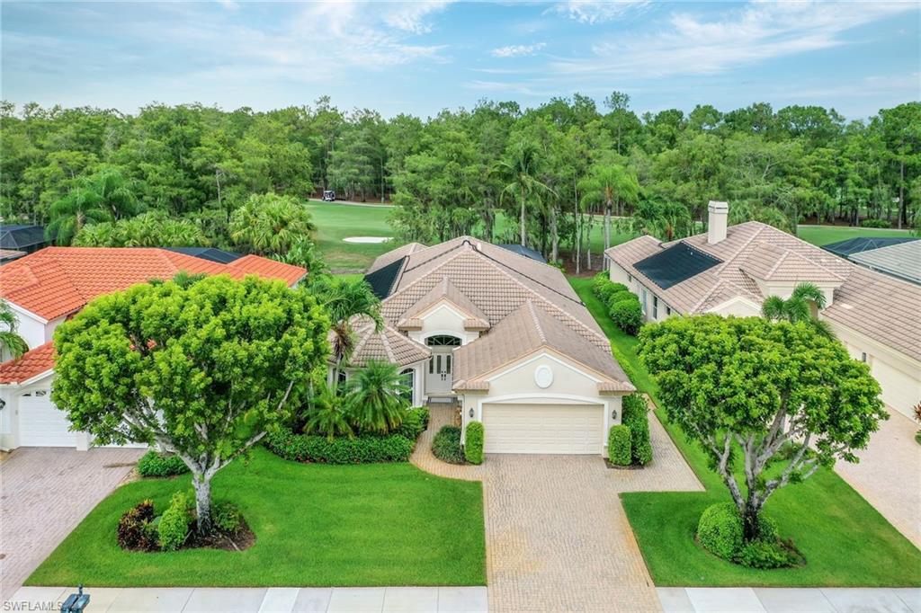 2885 Lone Pine Lane Naples, FL 34119 - Photo 26 of 29 a view of a house with a yard and potted plants