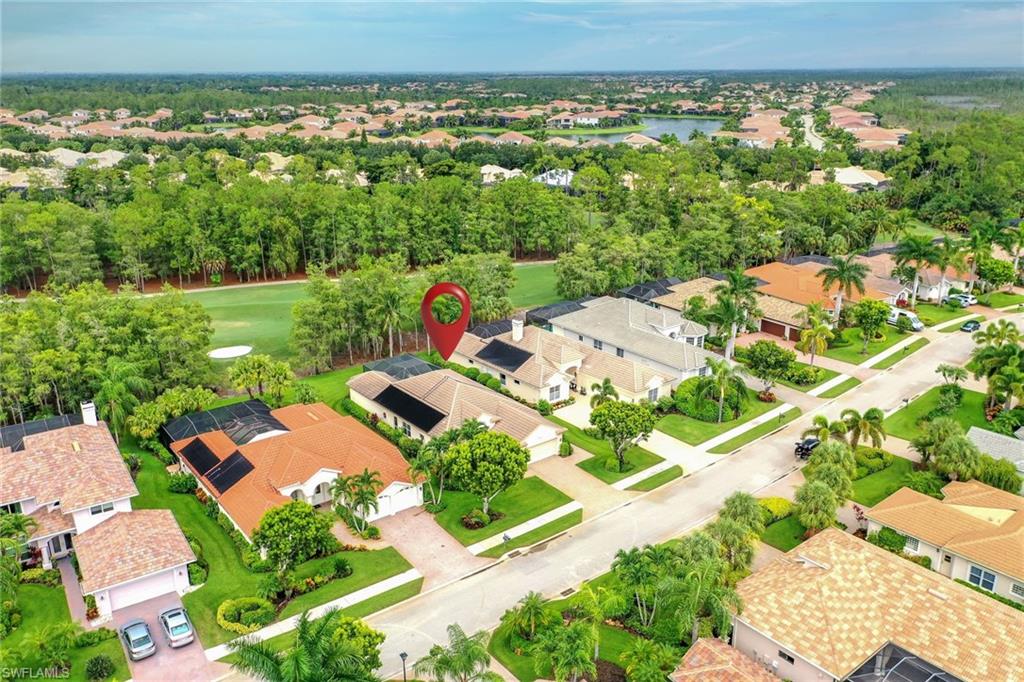 2885 Lone Pine Lane Naples, FL 34119 - Photo 28 of 29 an aerial view of a house with a garden