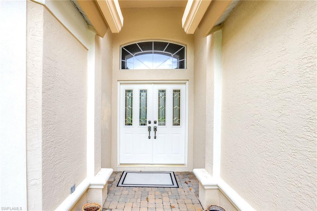 2885 Lone Pine Lane Naples, FL 34119 - Photo 29 of 29 a bathroom with a sink and a mirror