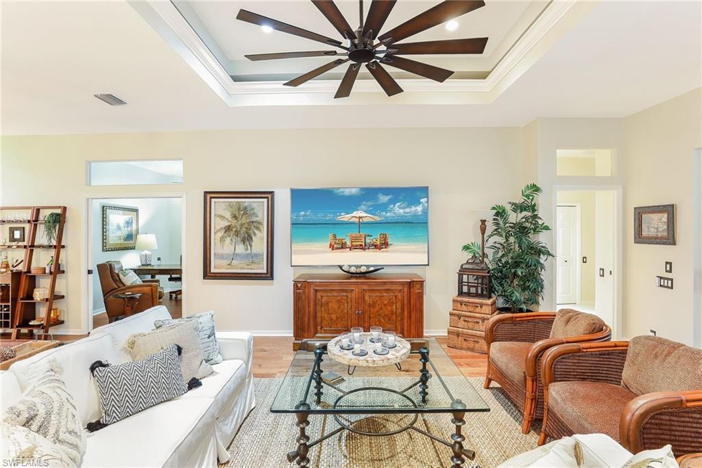 2885 Lone Pine Lane Naples, FL 34119 - Photo 5 of 29 a living room with furniture and a fireplace