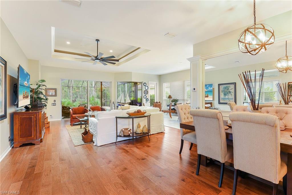 2885 Lone Pine Lane Naples, FL 34119 - Photo 7 of 29 a living room with fireplace furniture and a large window