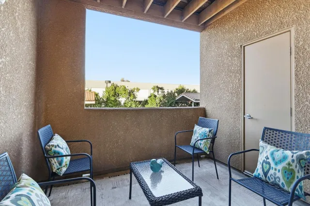a couple of chairs sitting in a backyard