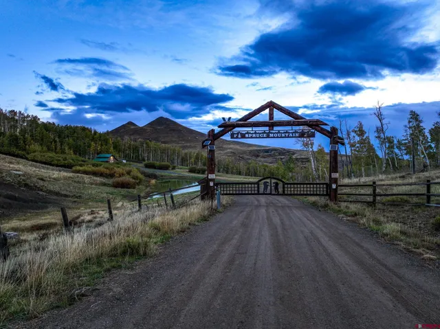 a view of a street with a bench in front of it