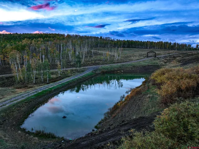 a view of a lake in a sunset