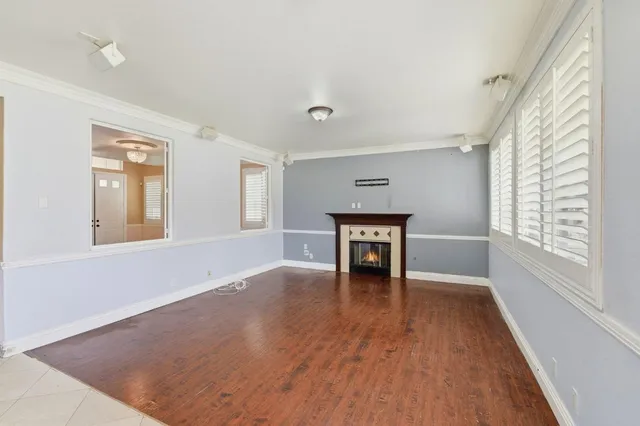 a kitchen with stainless steel appliances granite countertop wooden cabinets a sink dishwasher a stove and a refrigerator