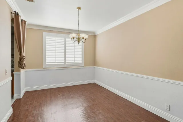 a view of kitchen with stainless steel appliances cabinets