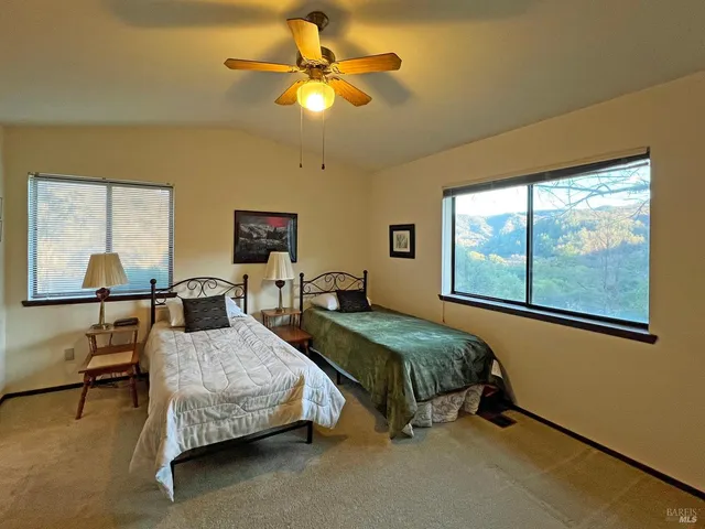 a bedroom with bed and window
