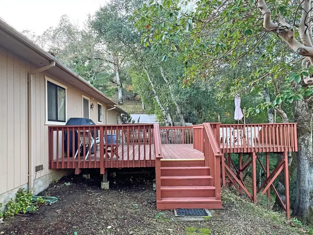 a view of a deck with a fence and a fence
