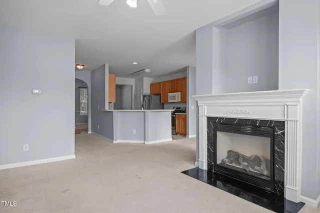 a view of a white building with large windows