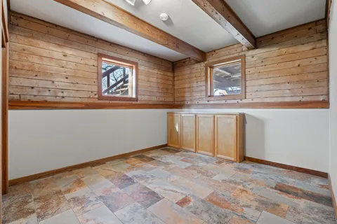 a bathroom with a toilet sink vanity and mirror
