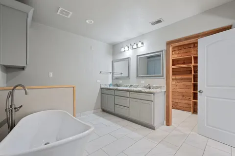 a view of entryway hall and wooden floor