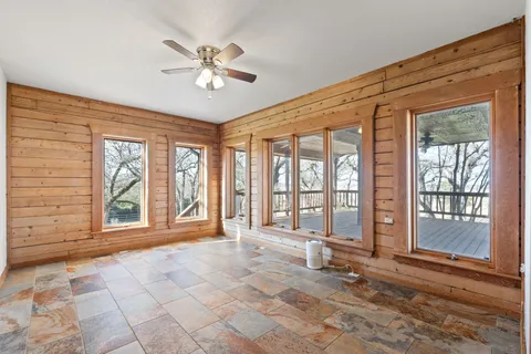 a view of an empty room with a window