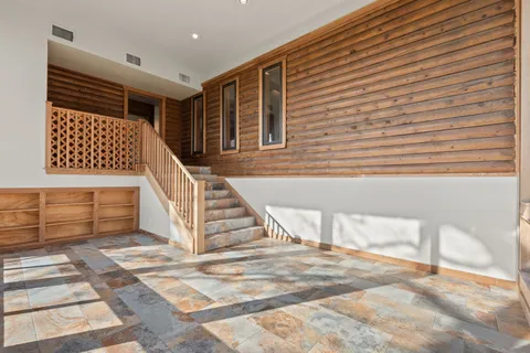 a swimming pool with trees in front of it