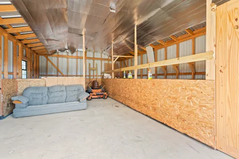 a view of a field with an trees in the background