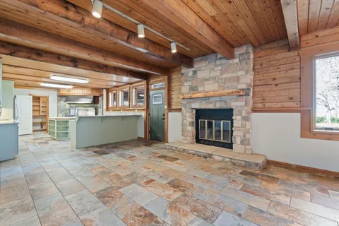 a kitchen with a refrigerator and a sink