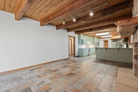 a kitchen with granite countertop cabinets stainless steel appliances and a counter space