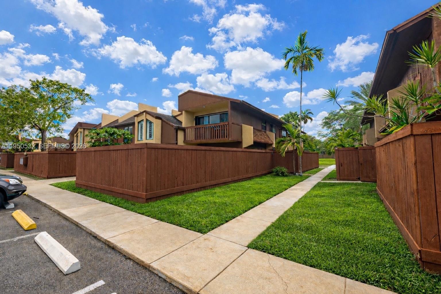 6534 Southwest 114th Place, Unit G75 Miami, FL 33173 - Photo 1 of 52 a view of a garden with a pathway