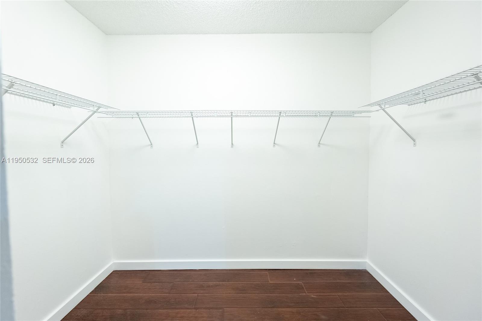 6534 Southwest 114th Place, Unit G75 Miami, FL 33173 - Photo 26 of 52 a view of small space with racks on the wall