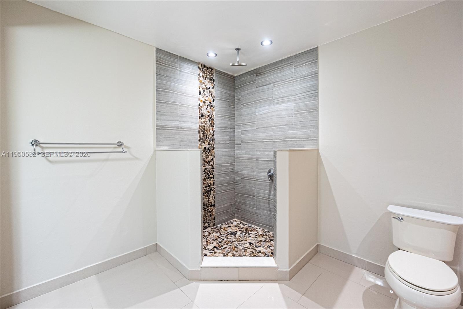 6534 Southwest 114th Place, Unit G75 Miami, FL 33173 - Photo 27 of 52 a bathroom with a shower and a toilet