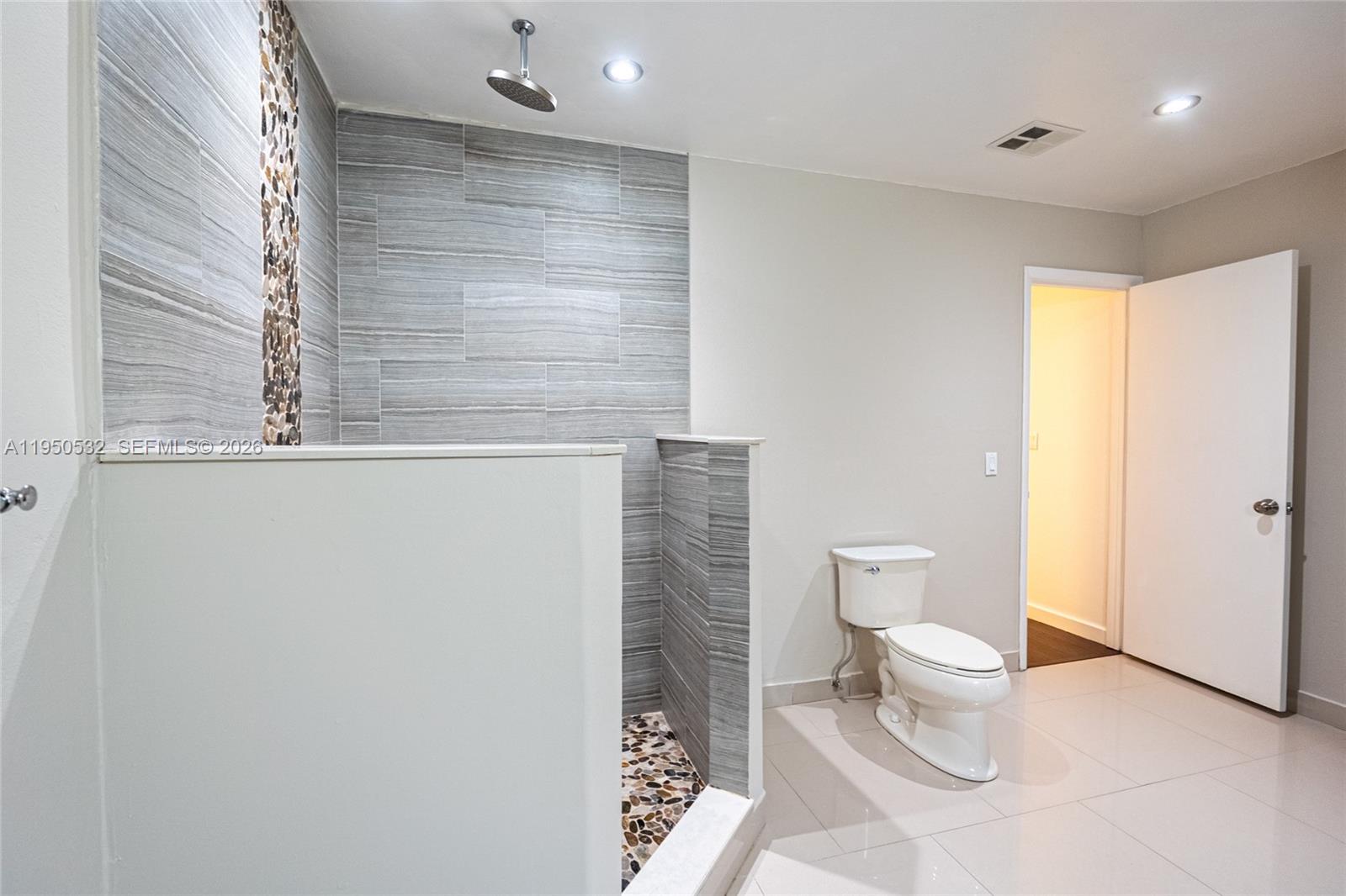 6534 Southwest 114th Place, Unit G75 Miami, FL 33173 - Photo 29 of 52 a bathroom with a toilet a sink and a window