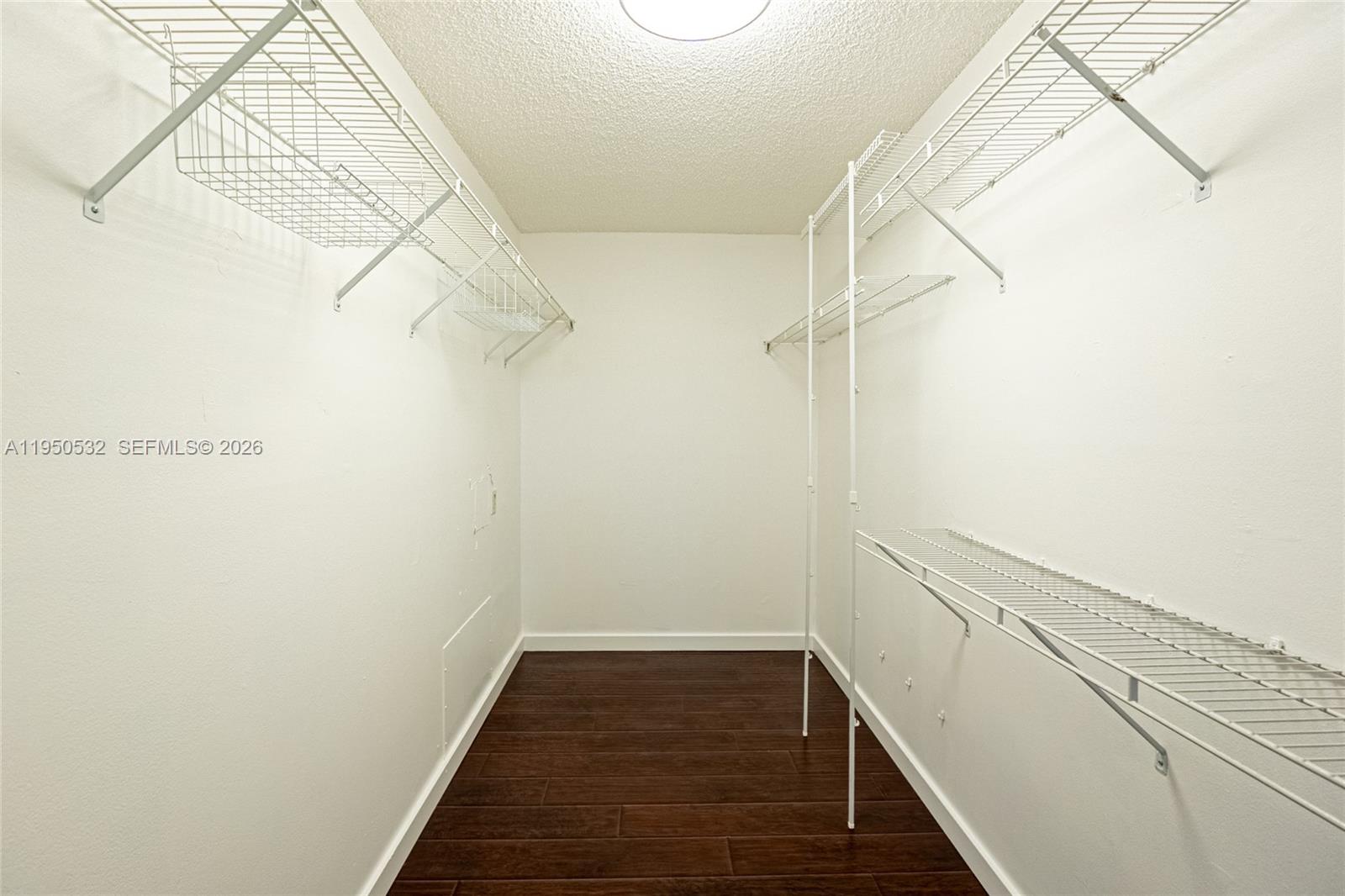 6534 Southwest 114th Place, Unit G75 Miami, FL 33173 - Photo 34 of 52 a view of a room with racks on the wall