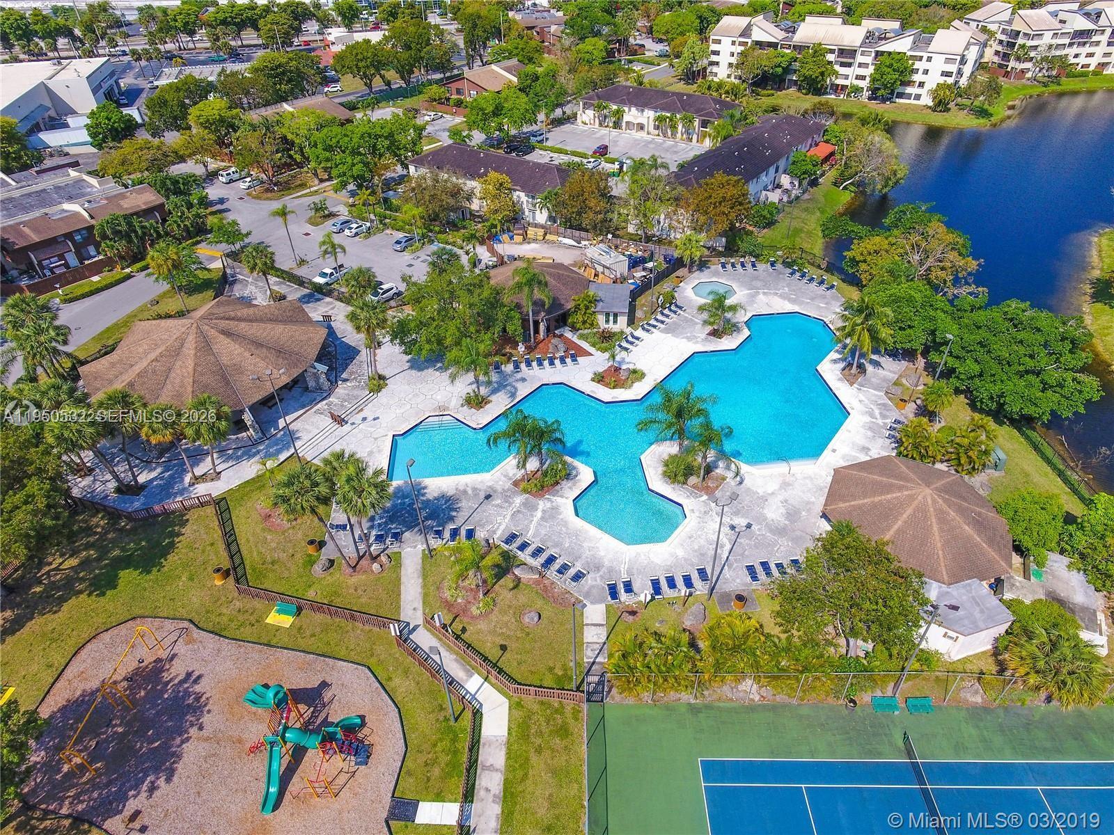 6534 Southwest 114th Place, Unit G75 Miami, FL 33173 - Photo 38 of 52 an aerial view of a swimming pool patio swimming pool and outdoor seating