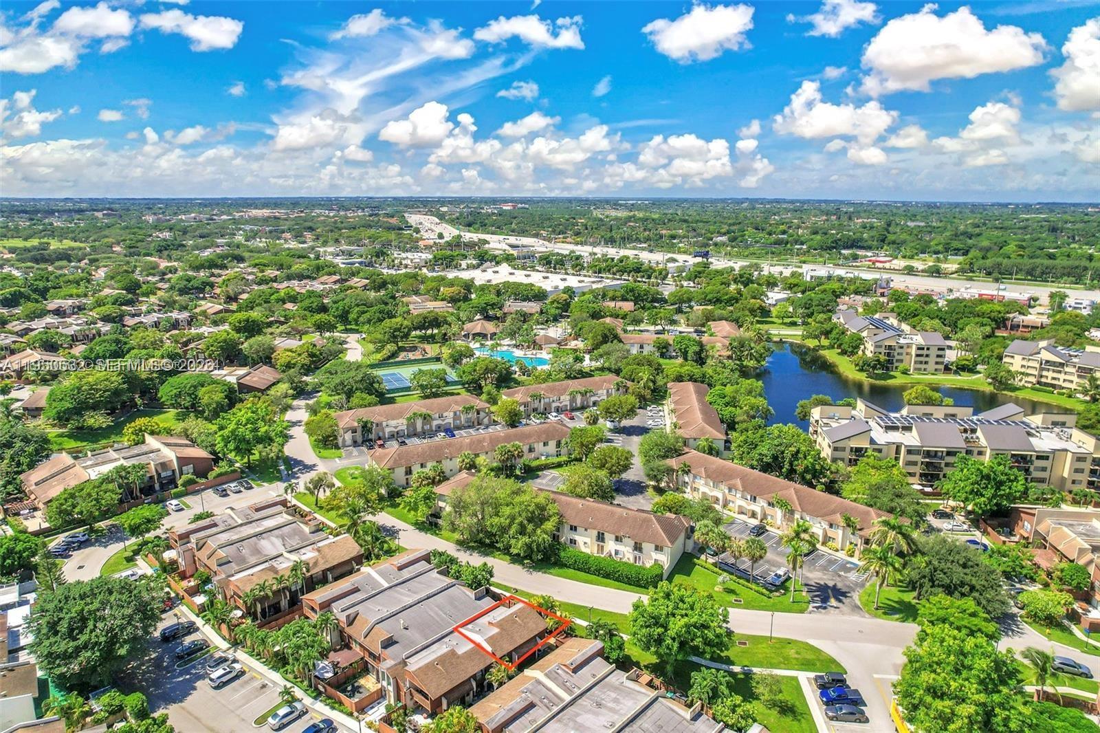 6534 Southwest 114th Place, Unit G75 Miami, FL 33173 - Photo 40 of 52 an aerial view of residential houses with outdoor space