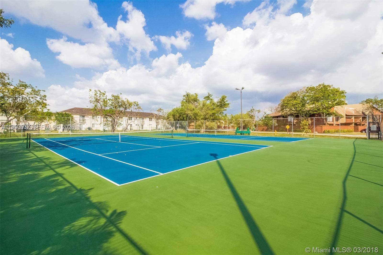 6534 Southwest 114th Place, Unit G75 Miami, FL 33173 - Photo 50 of 52 a view of a tennis court