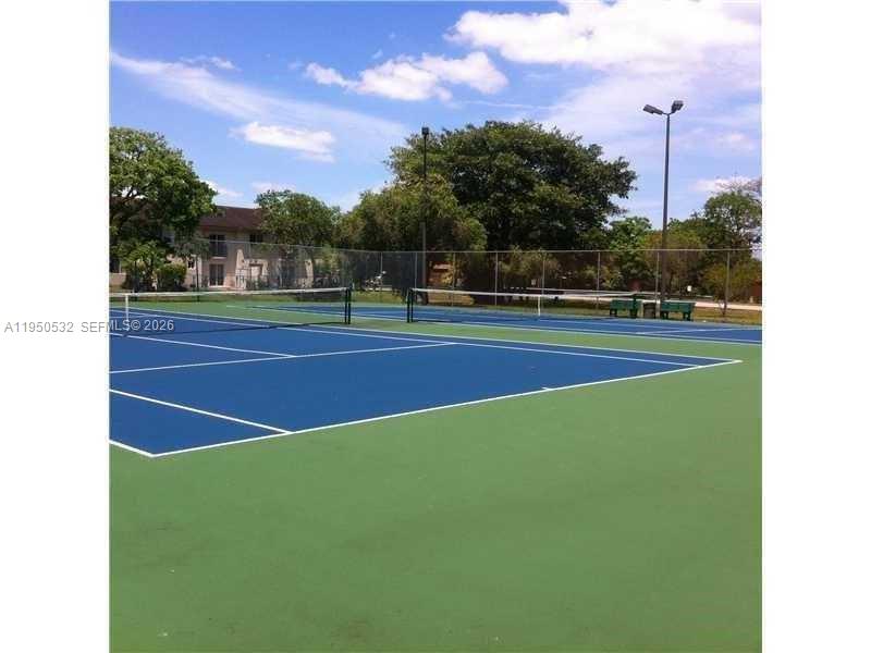 6534 Southwest 114th Place, Unit G75 Miami, FL 33173 - Photo 51 of 52 a view of a tennis court