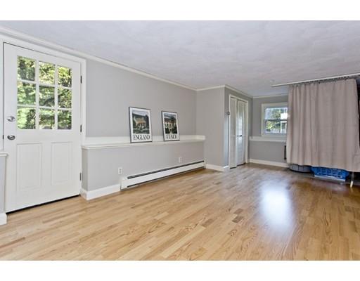 8 Rustic Lane Reading, MA 01867 - Photo 23 of 29 a view of an empty room with wooden floor and a window
