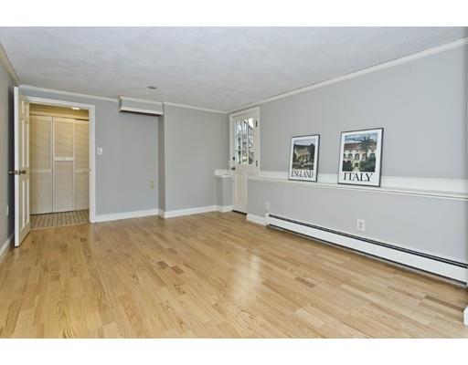 8 Rustic Lane Reading, MA 01867 - Photo 24 of 29 a view of empty room with wooden floor