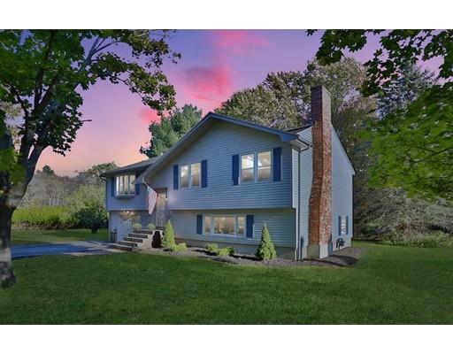 8 Rustic Lane Reading, MA 01867 - Photo 29 of 29 a front view of a house with a garden