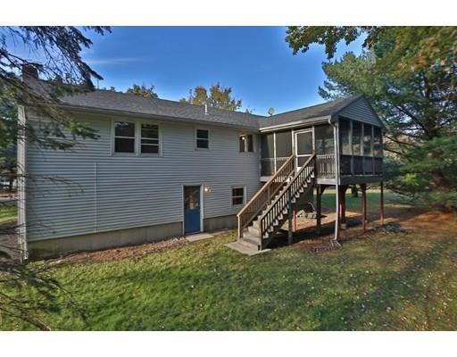 8 Rustic Lane Reading, MA 01867 - Photo 6 of 29 a view of a house with a backyard