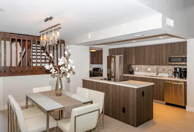 a bedroom with a bed potted plant with the window