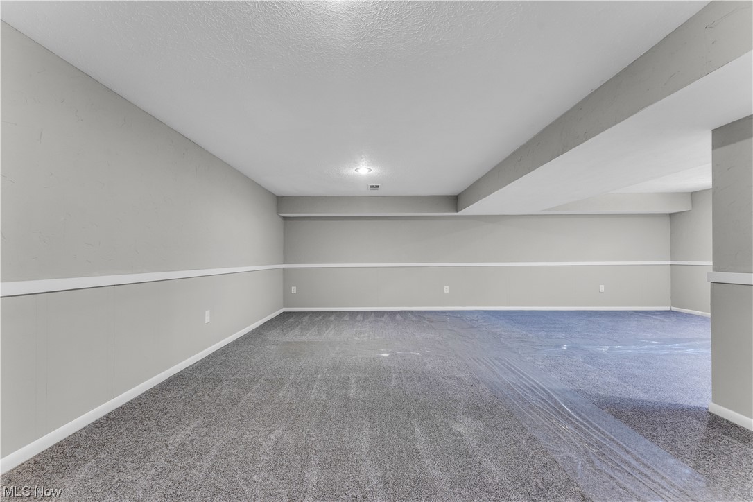 5025 Clubside Road Lyndhurst, OH 44124 - Photo 30 of 35 Carpeted spare room with a textured ceiling