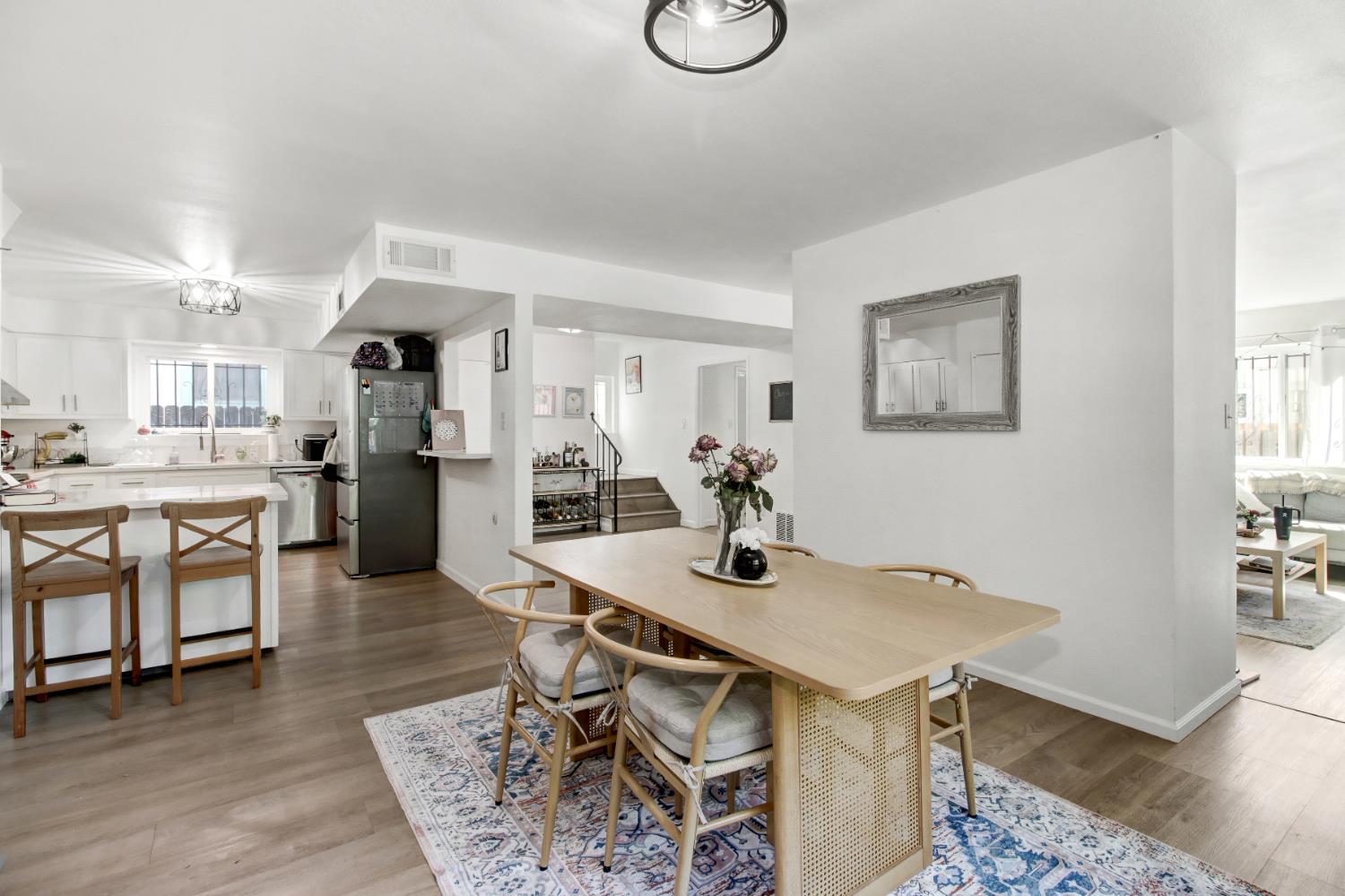 1916 17th Street Sacramento, CA 95811 - Photo 1 of 33 a kitchen with stainless steel appliances kitchen island a table and chairs in it