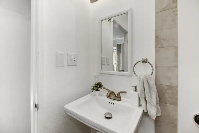 a bedroom with a bed a couch and book shelf